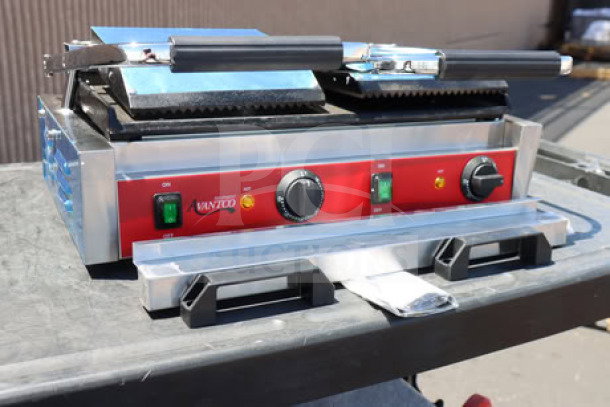 Avantco PG400GS dual panini grill, grooved top, smooth bottom, 19 5/8" x 9 1/8" surface, 120V, 3500W, new scratch-n-dent.