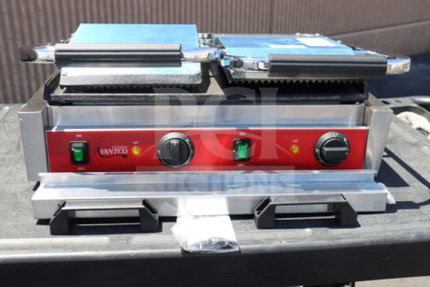 Avantco PG400GS dual panini grill with grooved top, smooth bottom plates, 19 5/8" x 9 1/8" cooking surface, new condition.