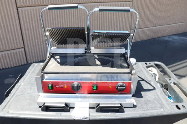 Brand new Avantco PG400GS commercial panini grill with grooved top, smooth bottom plates, 19 5/8" x 9 1/8" surface.