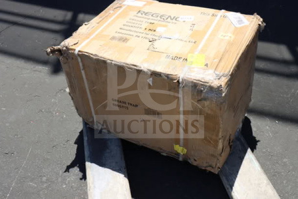 Brand new Regency 600GT15 30 lb. grease trap with 2" non-threaded connections, PDI certified; damaged packaging.