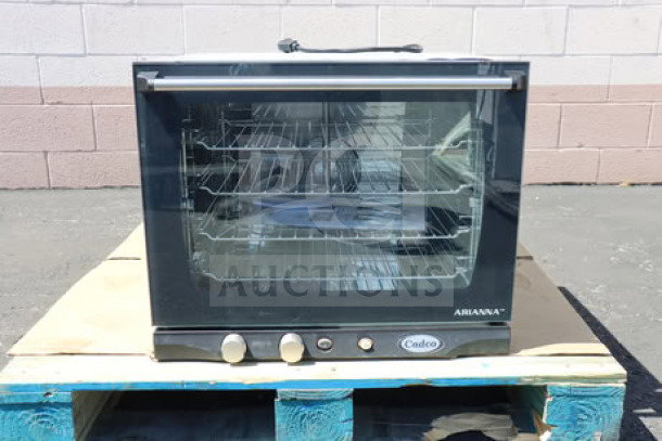 Brand new Cadco Arianna XAF-133 countertop convection oven, 4-shelf, manual controls, 208-240V.