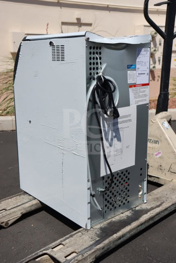Brand new Scotsman UF1415AX-1A flake ice machine, air-cooled, 15" undercounter, 36 lb bin, 115V, scratch-n-dent condition.