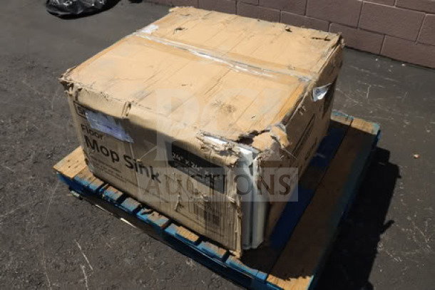 Damaged packaging of a new Steelton 29" 18 Gauge 304 Stainless Steel Mop Sink, Model 522MS242412. Box on pallet.