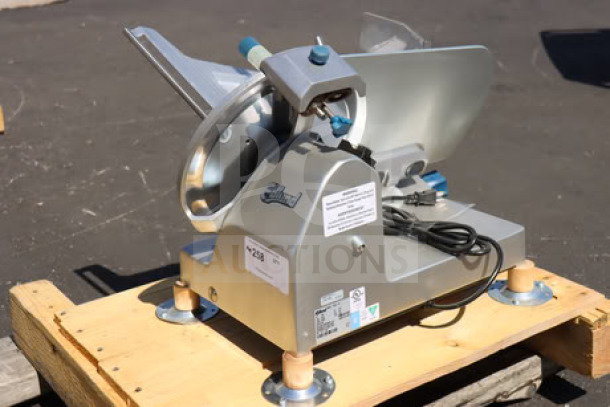 Brand new Edlund EDV-12 12" manual meat slicer, 1/2 hp, 115 volts, minor scratches, out of original packaging.