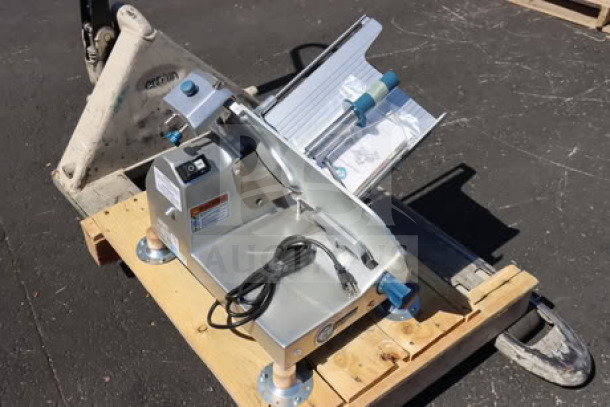 Edlund EDV-12 12" manual meat slicer, 1/2 hp, 115V, medium-duty. Out of packaging, possible scratches and dents visible.