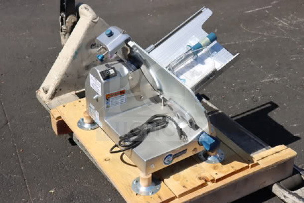 Edlund EDV-12 12" medium-duty manual meat slicer, 1/2 hp, 115 volts, new with minor scratches and dents, serial #20BCJI1167.