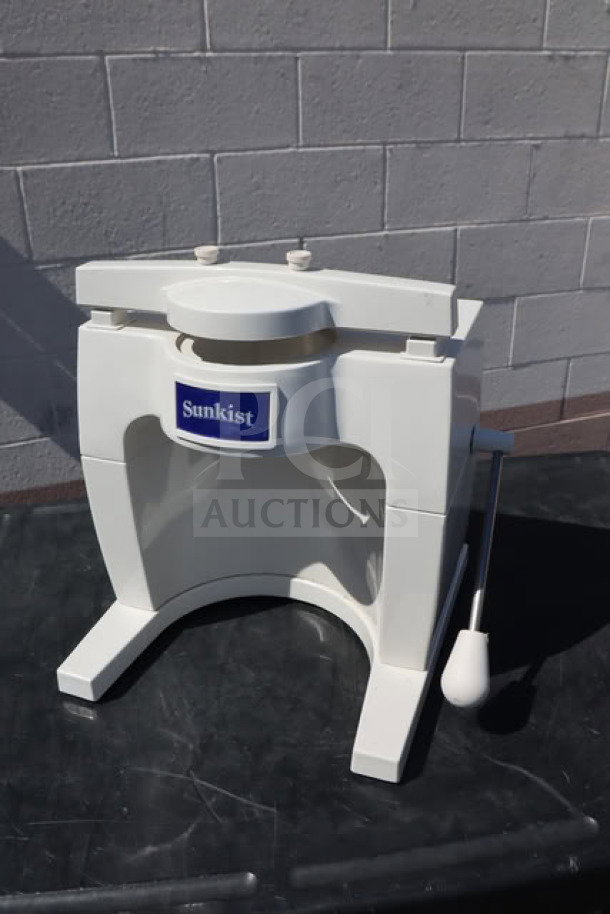 Sunkist S-100 Commercial Sectionizer, white, no attachments, sturdy design, visible Sunkist label, excellent condition.