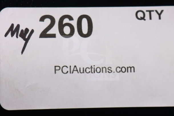 White auction label showing "260," "QTY," and "PCIAuctions.com" text in black.