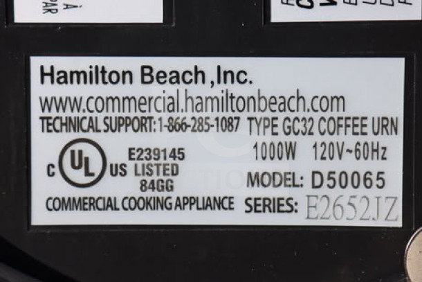 Hamilton Beach coffee urn label showing model D50065, 1000W, 120V, serial E2652JZ, and UL listing for commercial use.