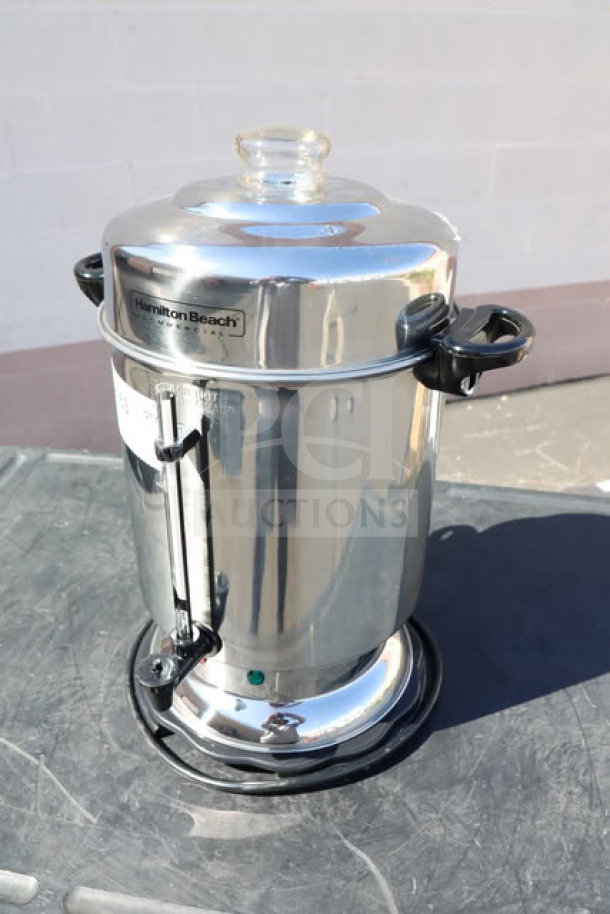 Brand new Hamilton Beach D50065 60-cup stainless steel coffee urn, 1000W, 120V, minor dents, commercial use, serial E2652JZ.