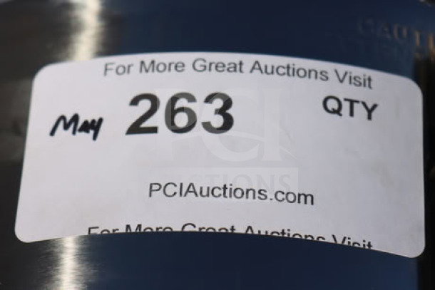 Label on a Hamilton Beach D50065 coffee urn indicates auction details: "May 263 QTY, PCIAuctions.com."