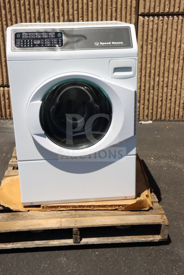 Brand new Speed Queen FF7012WN 3.5 cu. ft. front load washer on a pallet, right hinged, front control panel, minor dents.