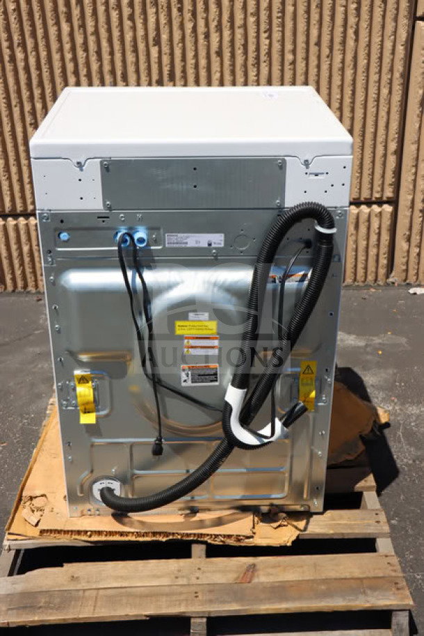 BRAND NEW SCRATCH-N-DENT Speed Queen FF7012WN, 27" front load washer, shown from the back on a pallet, includes labels and hoses.