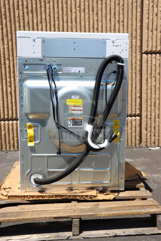 Speed Queen FF7012WN 3.5 cu. ft. front load washer, new with slight scratches. Includes rear hoses and labels, serial 2602035547.