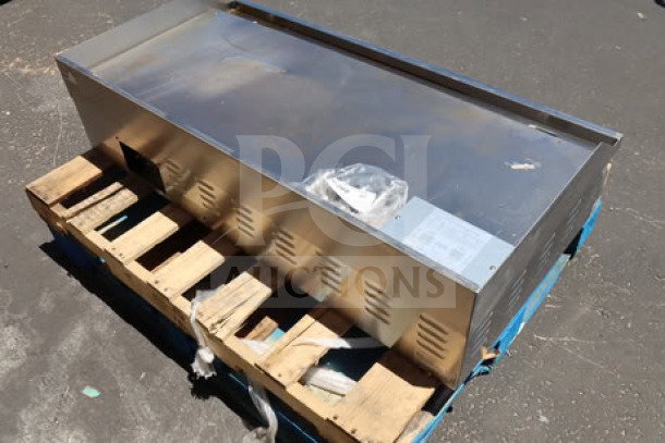 Avantco EG48N 48" electric countertop griddle on pallet. Stainless steel, 208/240V, 10482W-14000W, unused.
