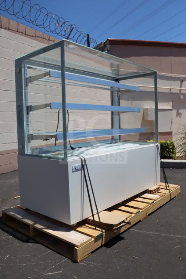 Avantco BCFD-60 white dry bakery display case with LED lighting, broken glass sections, on wooden pallet.