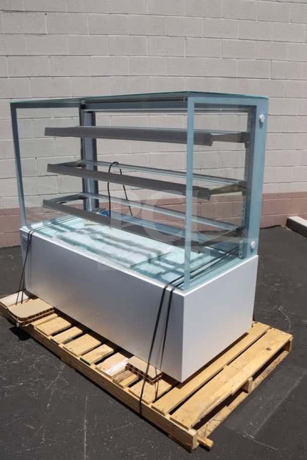 Avantco BCFD-60 white bakery display case with LED lighting, several broken glass panels, model visible on base.
