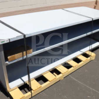 BRAND NEW Regency 30" x 96" stainless steel table, model 600EBT3096D, with sliding doors, midshelf, minor blemishes, unboxed.