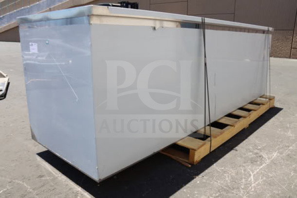 Brand new Regency 30" x 96" stainless steel table, model 600EBT3096D, with enclosed base, sliding doors, and adjustable midshelf; out of original packaging.
