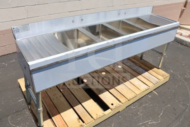 Advance Tabco SLB-64C 72"x18" four-compartment bar sink, two 12" drainboards, steel construction, scratch-n-dent condition.