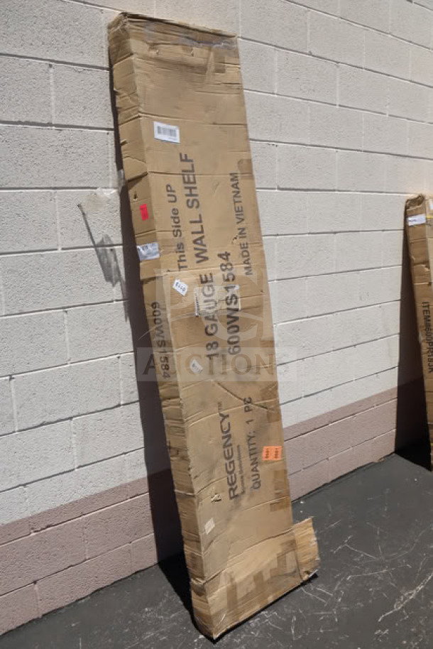 Brand new Regency 600WS1584 stainless steel wall shelf, 15"x84", in damaged box. 18 gauge, solid construction.