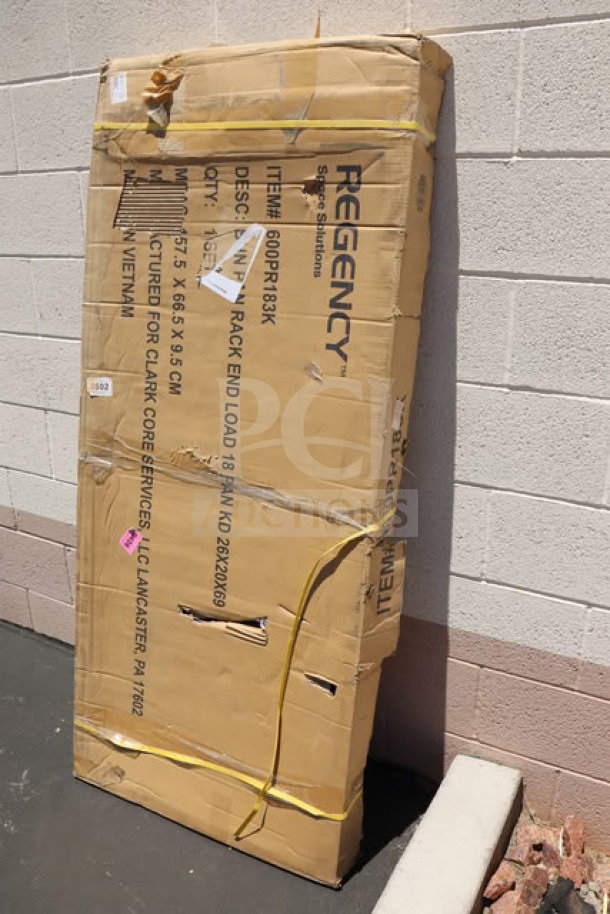 Alt text: Unassembled Regency 600PR183K 18 Pan End Load Sheet Pan Rack in original packaging with visible wear and tear on the box.