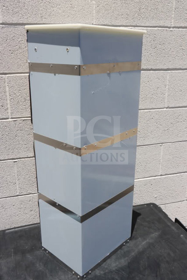 Brand new Choice 130BGGRICE Ice Bagger for 8-20 lb. bags, visible scratch-n-dent, metal bands, and secured panels.