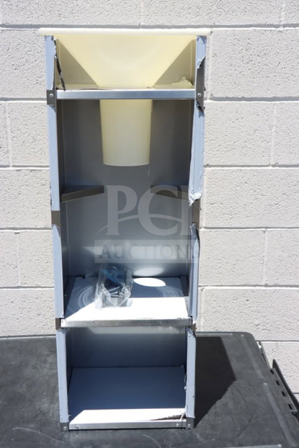 Brand new Choice 130BGGRICE ice bagger for 8, 10, 20 lb. bags, visible dents, plastic funnel, metal frame, accessory included.