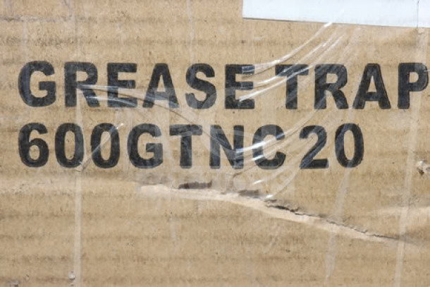 Regency 600GTNC20 grease trap packaging with visible scratch and dent, damaged original box.