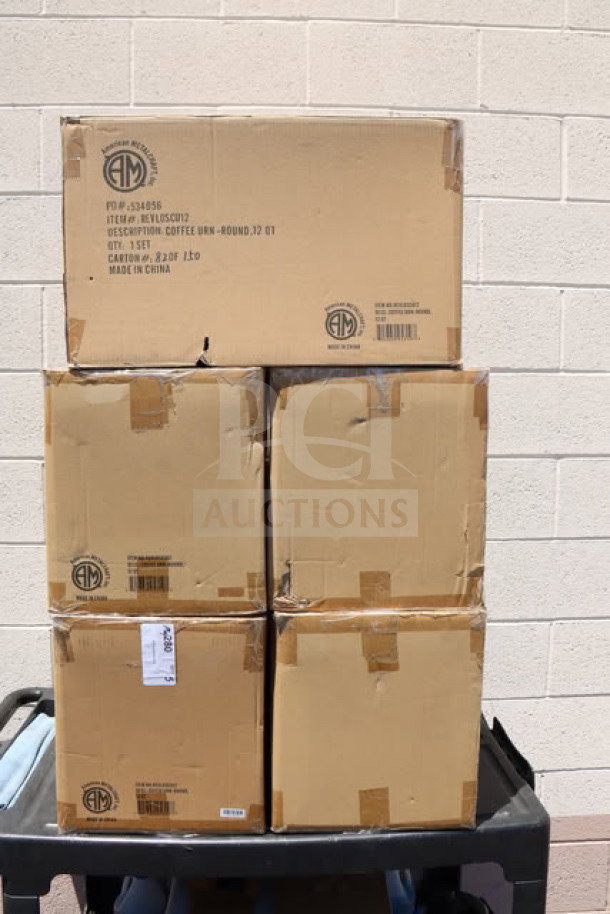 Brown boxes containing American Metalcraft REVLOSCU12 coffee urns, unopened. Labels show item details and location.
