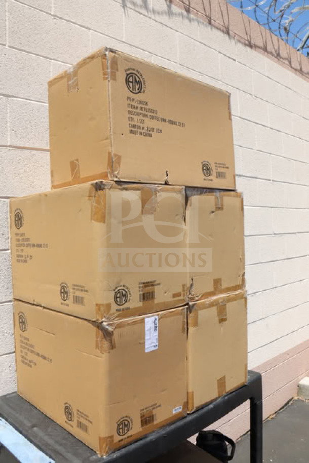 Boxes containing American Metalcraft REVLOSCU12 12 Qt. coffee urns in unopened packaging. Visible labels show product details.