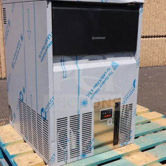BRAND NEW Scotsman UC0918GAX-1A 18" air-cooled undercounter ice machine on a pallet, with visible protective wrapping, minor scratches.