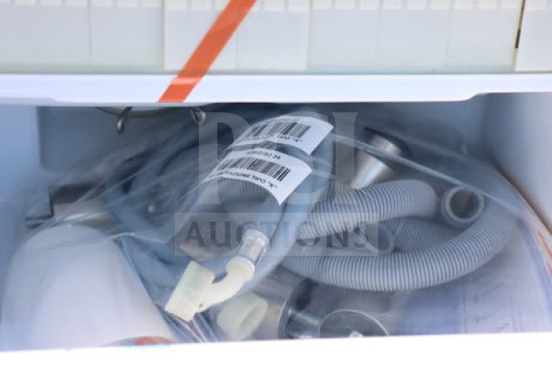 Scotsman UC0918GAX-1A ice machine parts with barcode labels, minor scratches visible.