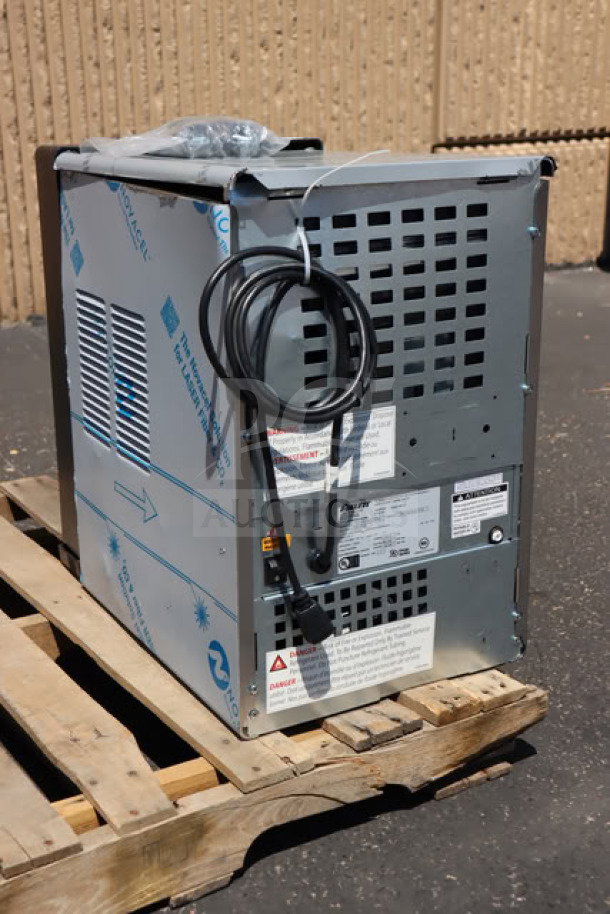 Brand new Follett 15CI114A-IW-CL-ST-00 countertop ice maker, air-cooled, 15 lb. bin, 115V, with visible power cord and labels.