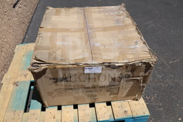 Regency stainless steel mop sink, model 600SM242412, in damaged packaging with visible dents and scratches.
