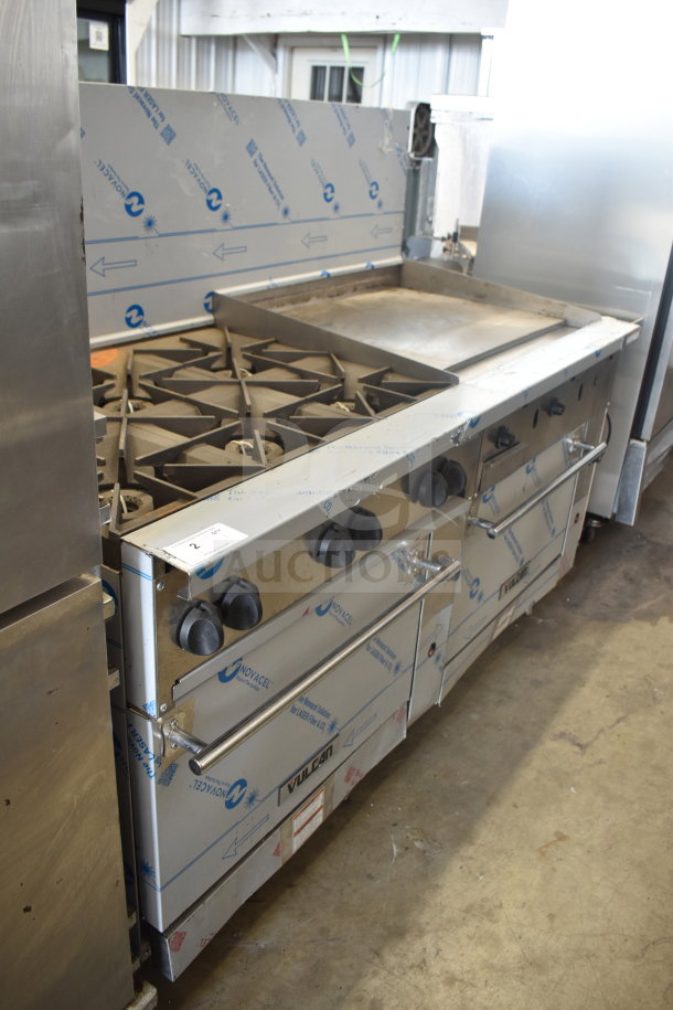Vulcan 72SS-6B36GTN commercial range with 6 burners, flat top griddle, 2 ovens, and backsplash. New condition.
