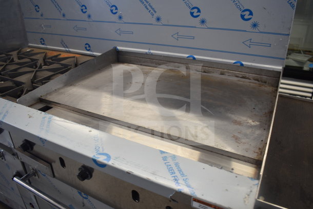 Vulcan 72SS-6B36GTN commercial 6 burner range with flat top griddle, 2 ovens, and backsplash. Natural gas. Slight wear.
