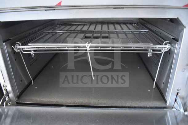 Interior view of Vulcan 72SS-6B36GTN oven. Clean wire rack, spacious design, suitable for commercial use.