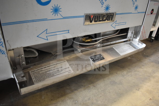 Vulcan 72SS-6B36GTN commercial gas range with 6 burners, flat top griddle, 2 ovens, backsplash. Features include visible Vulcan logo and instructions plate.