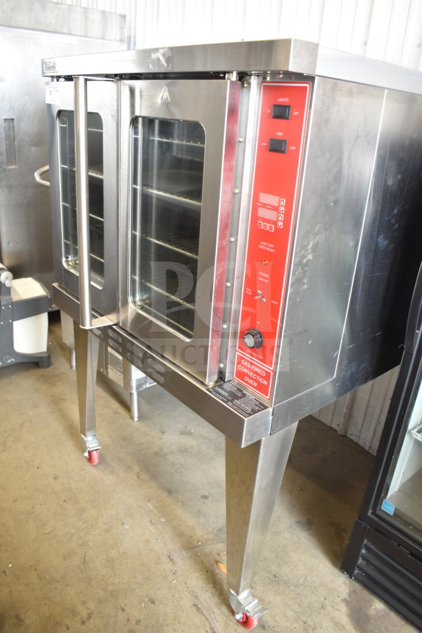 Migali commercial gas convection oven, full size, view-through doors, metal legs, commercial casters, red control panel.