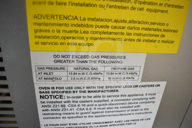 Migali commercial gas convection oven label showing gas pressure requirements and installation instructions.