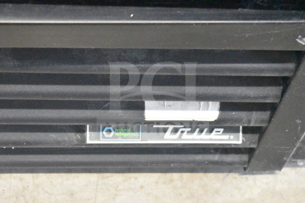 2017 True GDM-72-HC cooler grill with logo and "natural refrigerant" label visible, indicating eco-friendly refrigeration.