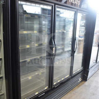 2017 True GDM-72F-HC three-door reach-in freezer merchandiser, 115/208-230V, 1 phase, tested and working, shown in a storefront.