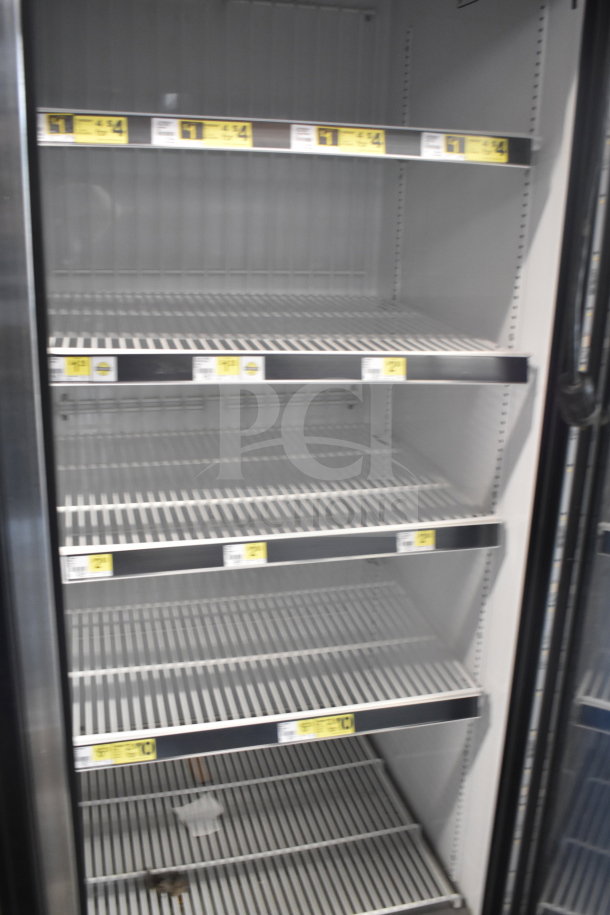 2017 True GDM-72F-HC 3 Door Freezer Merchandiser, gray interior with multiple shelves, working condition, tested.