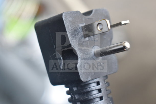 Close-up of a black power plug for the Avantco 184T140 conveyor toaster, showing prongs and cord detail.