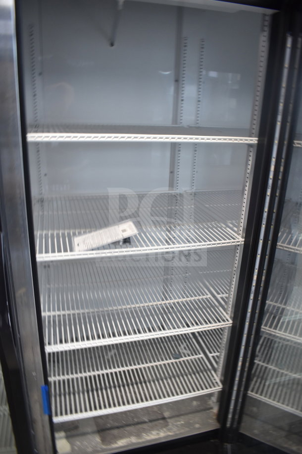 2019 True GDM-72-HC cooler, 3 glass doors, tested working, commercial use, 115V, 1-phase, white wire shelves inside.