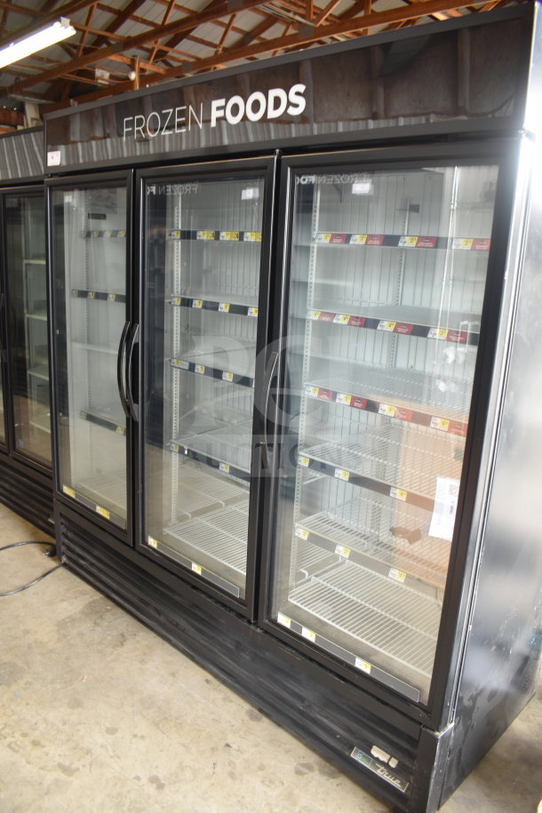 2017 True GDM-72F-HC commercial 3-door freezer merchandiser. Glass doors, shelving inside, tested, and working condition.