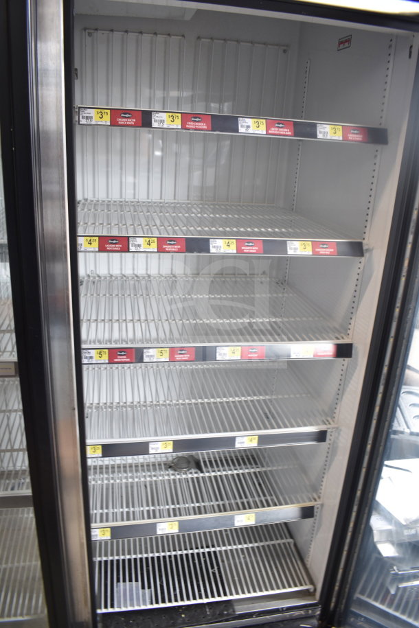 2017 True GDM-72F-HC commercial 3-door freezer merchandiser, tested and working, empty shelves, interior view.