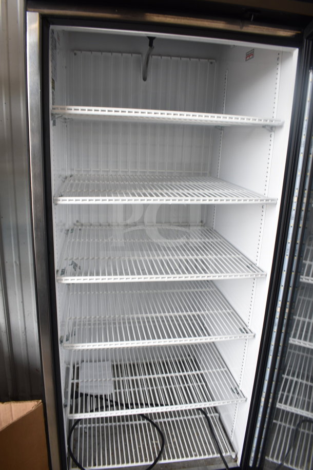 2019 True GDM-23F-HC commercial freezer merchandiser, single door, white interior, multiple shelves, 115 volts, well-maintained.