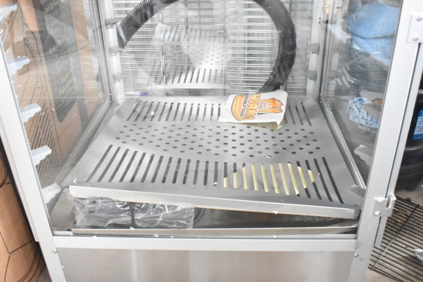 Brand new Carnival King 382HPW18D2S 18" warmer/merchandiser, 120V, with scratch and dent, featuring stainless interior.